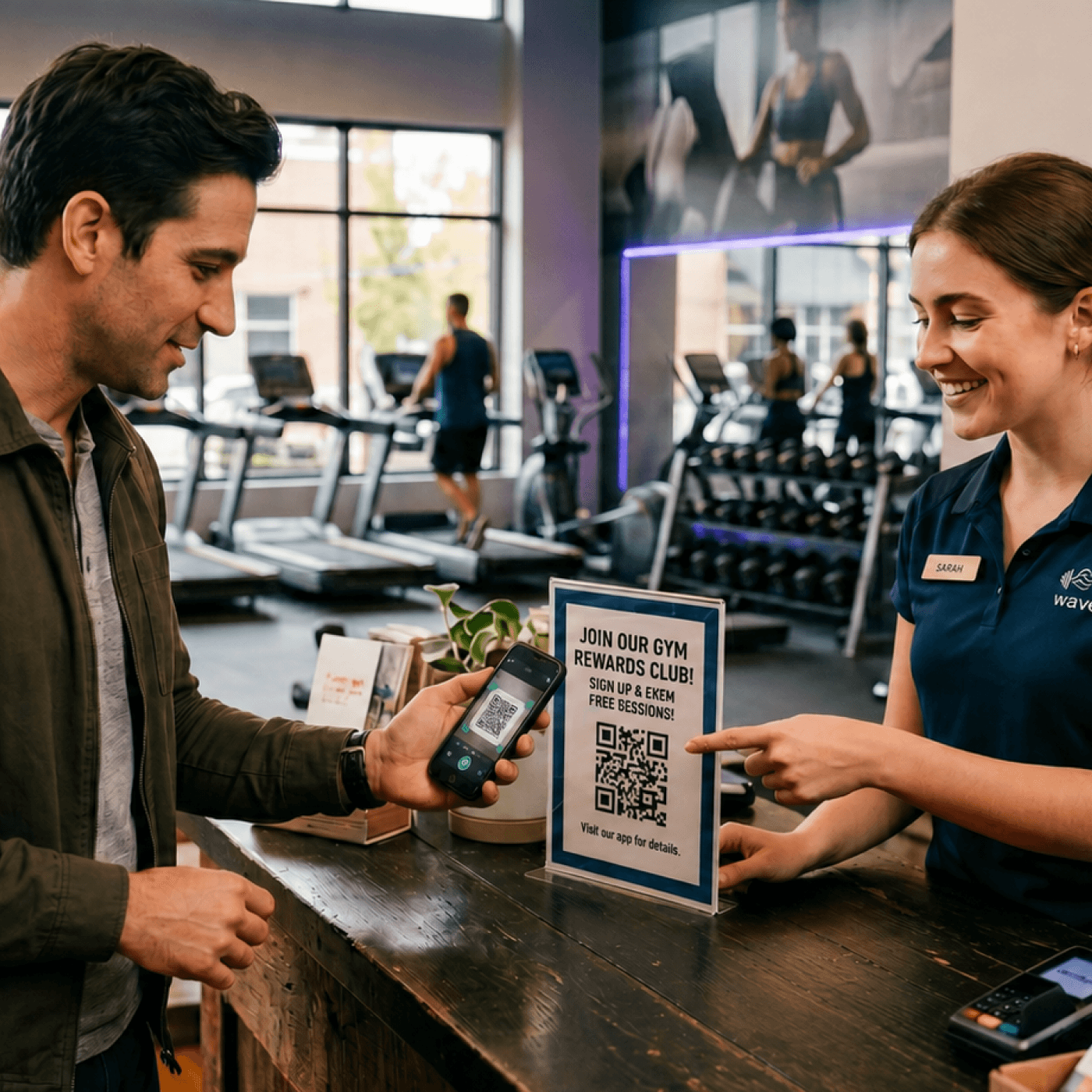 Attendant helping a customer scan and grab a Loytu loyalty card